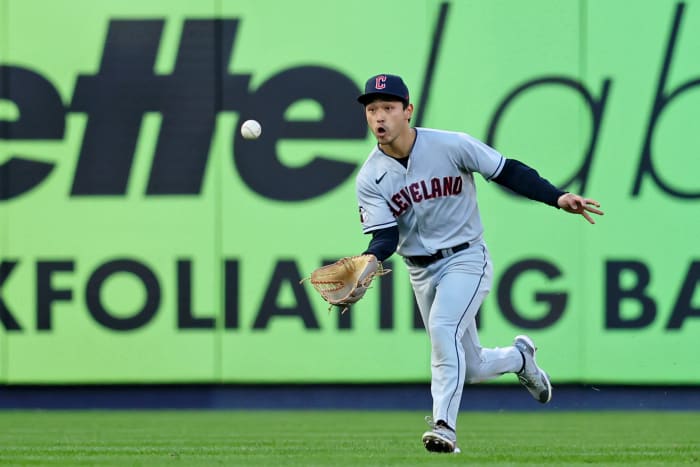 Steven Kwan makes a running, basket-style catch in left field.